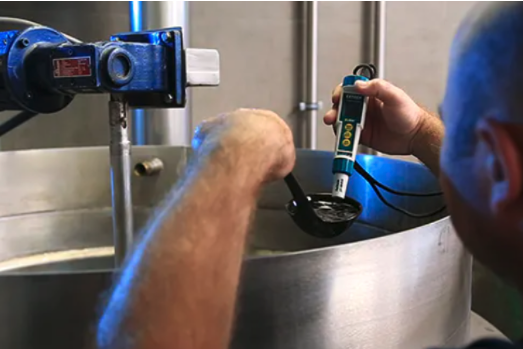 Plumber measuring hard water levels